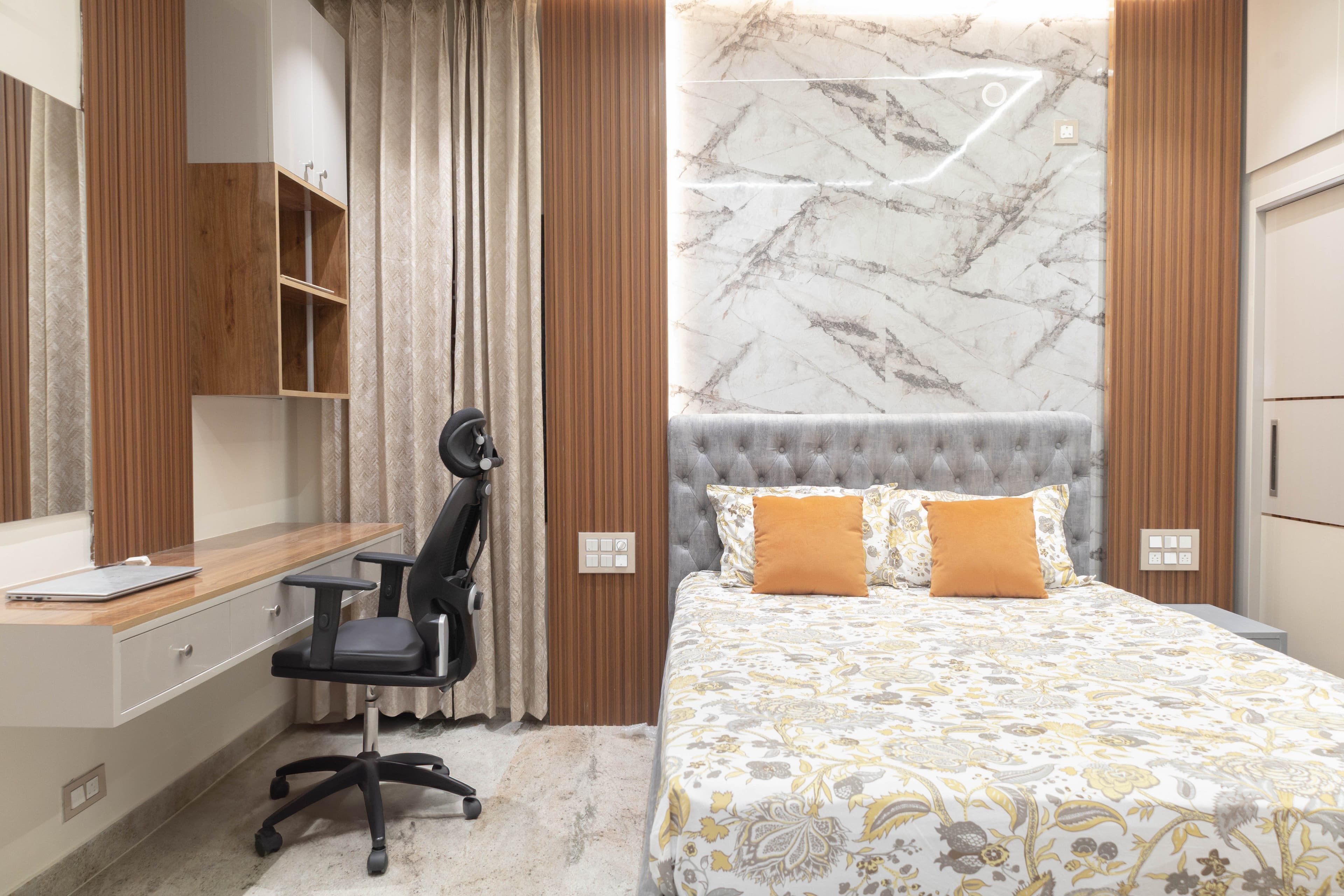 Master bedroom with marble headboard and study desk